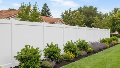 White wooden privacy fence installation by Chop Chop Landscaping in San Jose, CA showcasing expert craftsmanship